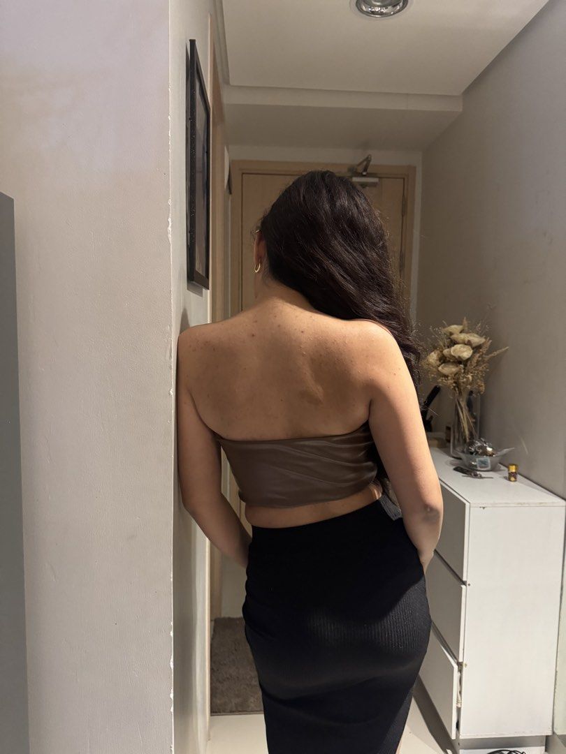Brown Leather Corset Tube Top (Category: Others Tops) located in Makati City. Submitted by wearpy (Listing ID 1453608244, Image 2). Description: Model Info Height: 5'0 bust size: 32" waist: 27" hips: 36" - Cute brown faux leather tube top - Corset style with boning details - Cropped length - Versatile: pairs well with skirts or high-waisted pants - Ideal for a night out or a trendy look.