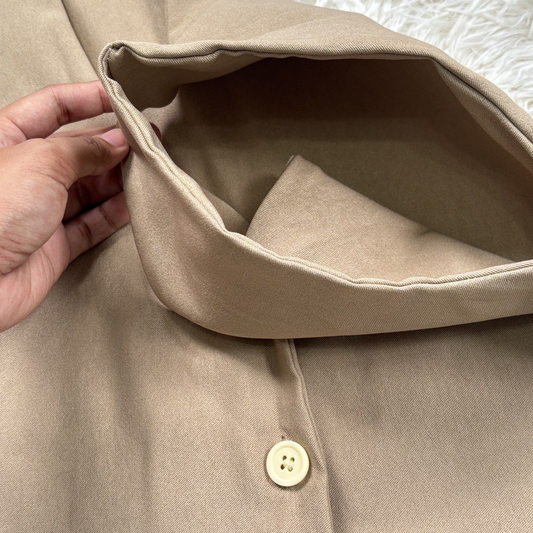 Brown V-Neck Button-Up Vest (Category: Vests) located in Manila. Submitted by kyleeee.mrr (Listing ID 1453573742, Image 2). Description: SMALL TO MED WOVEN FABRIC (double lining) - Simple brown vest - V-neckline with three button closures - Lightweight material, ideal for layering - Versatile piece for various outfits - Please check photos for detailed condition.