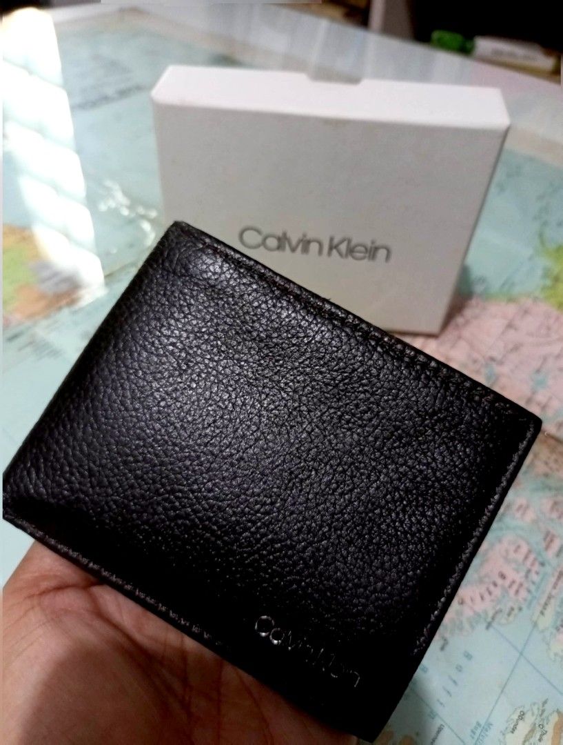 Calvin Klein Black Wallet (Category: Wallets & Card Holders) located in Valenzuela. Submitted by askingmiming (Listing ID 1453516854, Image 2). Description: - Brand: Calvin Klein - Material: Black pebbled leather - Features: RFID protection, multiple card slots, bill compartment - Condition: Brand new, comes in original box - Origin: Made in India - Ideal for: Everyday use ✔️ Authentic (Purchased in the USA) ✔️ Brand new, never used ✔️ Complete w
