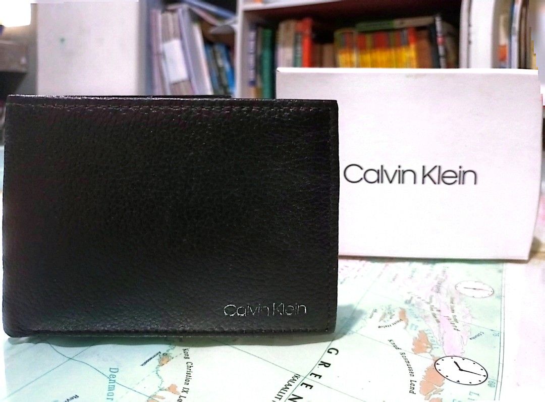 Calvin Klein Black Wallet (Category: Wallets & Card Holders) located in Valenzuela. Submitted by askingmiming (Listing ID 1453516854, Image 3). Description: - Brand: Calvin Klein - Material: Black pebbled leather - Features: RFID protection, multiple card slots, bill compartment - Condition: Brand new, comes in original box - Origin: Made in India - Ideal for: Everyday use ✔️ Authentic (Purchased in the USA) ✔️ Brand new, never used ✔️ Complete w