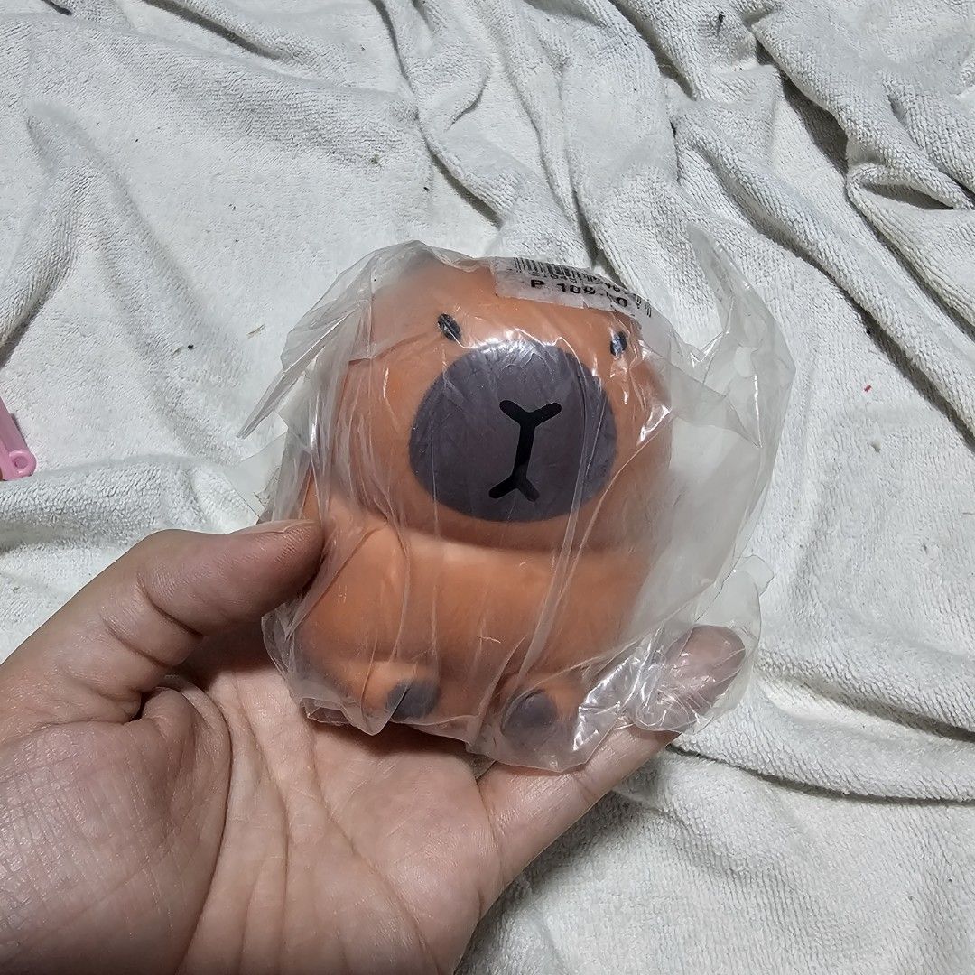 Capbyra sand squishy stretchy fidget toy (Category: Designer & Blind Box Toys) located in Mandaluyong City. Submitted by viviperera (Listing ID 1453614625, Image 1). Description: - Adorable orange bear squishy - Brand new, still in original packaging - Perfect for stress relief - Adds a cute touch to your desk - Super soft and squishy texture - Ideal for collectors or fans of cute toys.
