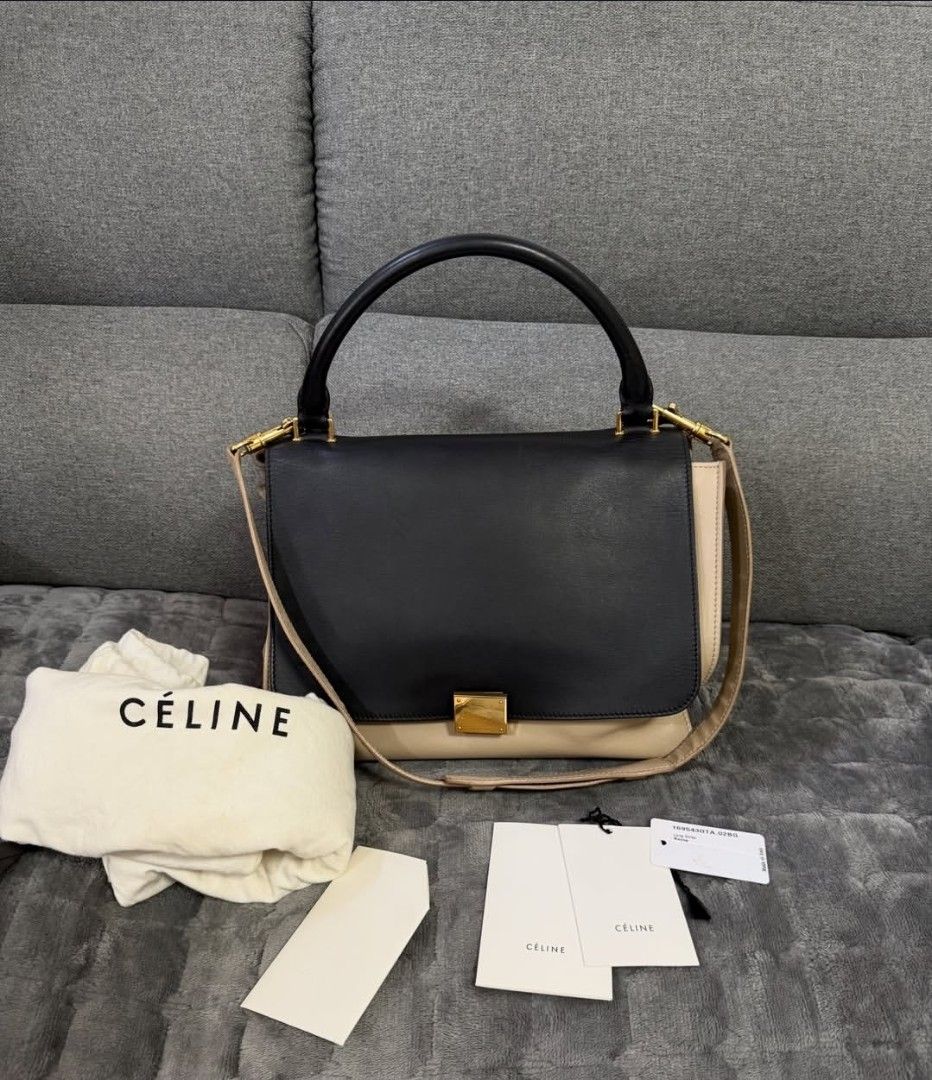 Celine Trapeze Bag Black Beige Leather Suede (Category: Luxury Bags & Wallets) located in Lopez. Submitted by declutteringproxie (Listing ID 1453532663, Image 2). Description: - Celine Trapeze Bag - Colors: Black, Beige - Materials: Leather and Suede - Hardware: Gold - Strap: Adjustable (top handle/shoulder/crossbody) - Includes: original dust bag, Tags - Style: transformable, unique, versatile for everyday wear - Authenticated by LegitApp with c