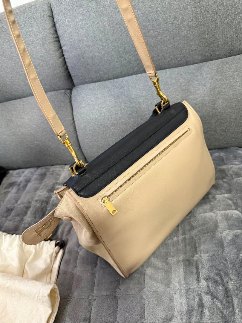Celine Trapeze Bag Black Beige Leather Suede (Category: Luxury Bags & Wallets) located in Lopez. Submitted by declutteringproxie (Listing ID 1453532663, Image 3). Description: - Celine Trapeze Bag - Colors: Black, Beige - Materials: Leather and Suede - Hardware: Gold - Strap: Adjustable (top handle/shoulder/crossbody) - Includes: original dust bag, Tags - Style: transformable, unique, versatile for everyday wear - Authenticated by LegitApp with c
