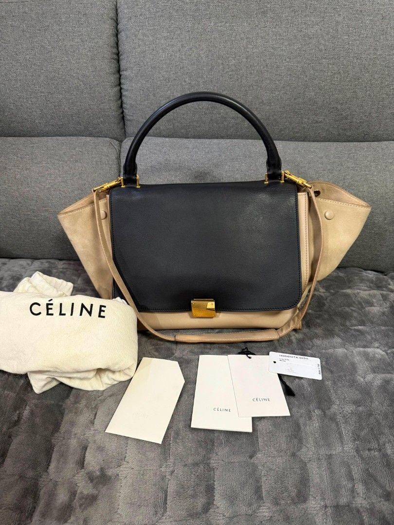 Celine Trapeze Bag Black Beige Leather Suede (Category: Luxury Bags & Wallets) located in Lopez. Submitted by declutteringproxie (Listing ID 1453532663, Image 1). Description: - Celine Trapeze Bag - Colors: Black, Beige - Materials: Leather and Suede - Hardware: Gold - Strap: Adjustable (top handle/shoulder/crossbody) - Includes: original dust bag, Tags - Style: transformable, unique, versatile for everyday wear - Authenticated by LegitApp with c