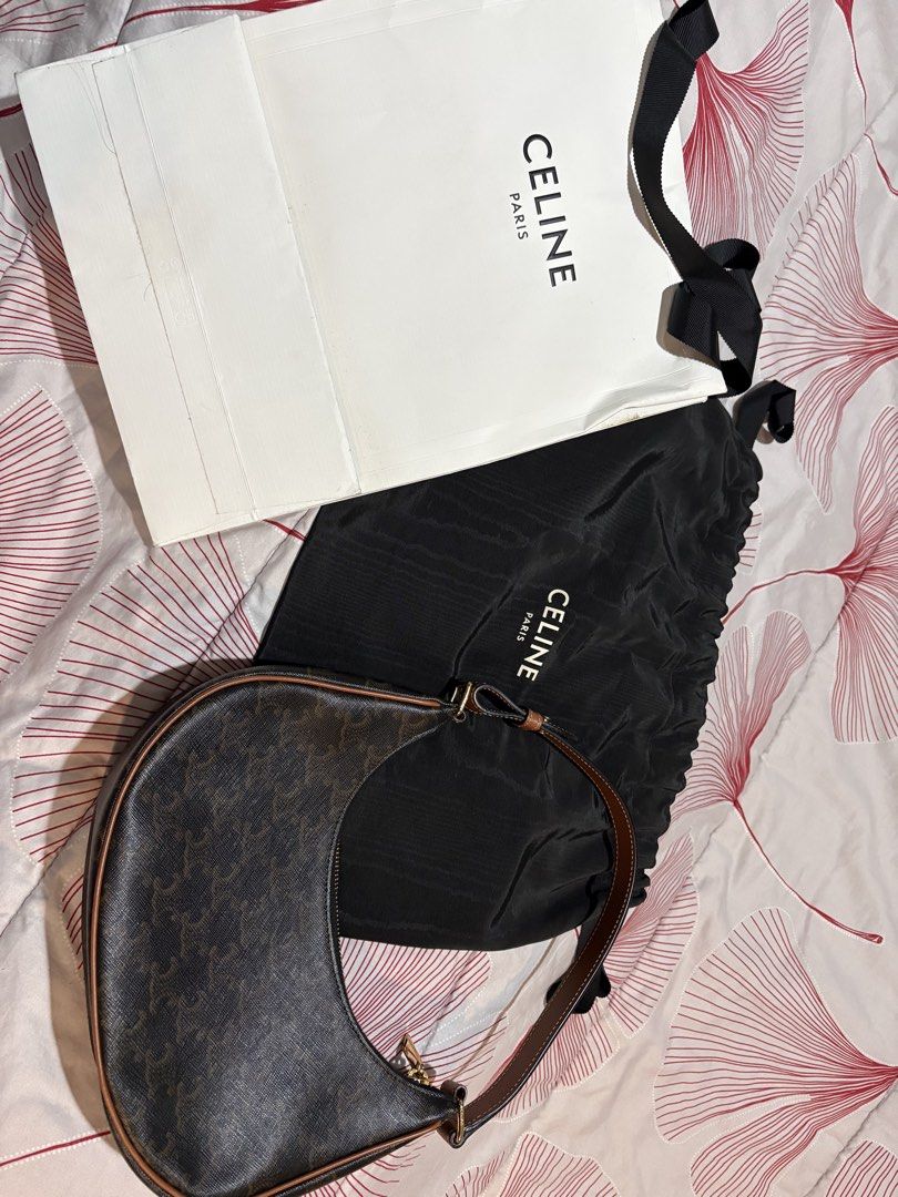 CELINE Triomphe Canvas Ava Bag (Category: Luxury Bags & Wallets) located in Quezon City. Submitted by tiffanyong87 (Listing ID 1453534226, Image 2). Description: - Authentic Celine Triomphe iCanvas Ava bag - Comes with original dust bag and shopping bag - Classic brown and tan monogram print - Genuine leather trim and strap - Secure zipper closure - Ideal stylish everyday bag.