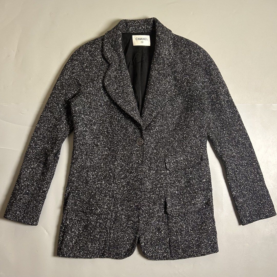 Chanel black and white speckled tweed jacket (Category: Luxury Apparel) located in Cebu City. Submitted by streetguruthrift (Listing ID 1453617645, Image 1). Description: Chanel black and white speckled tweed jacket -This single-breasted classic blazer features a notched lapel, structured shoulders, functional lower flap pockets, and a signature interlocking CC logo button at the front closure. The interior is finished with a luxury silk lining a