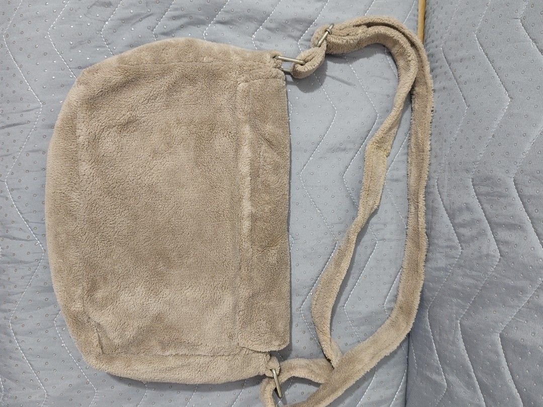 Chanel Terry Cloth Shoulder Bag (Category: Luxury Bags & Wallets) located in Bulacan. Submitted by abejeroamy80846 (Listing ID 1453618162, Image 2). Description: - Brown terry cloth shoulder bag - Iconic white Chanel CC logo on front flap - Matching terry cloth strap - Interior zippered compartment - Ideal for everyday style and convenience.