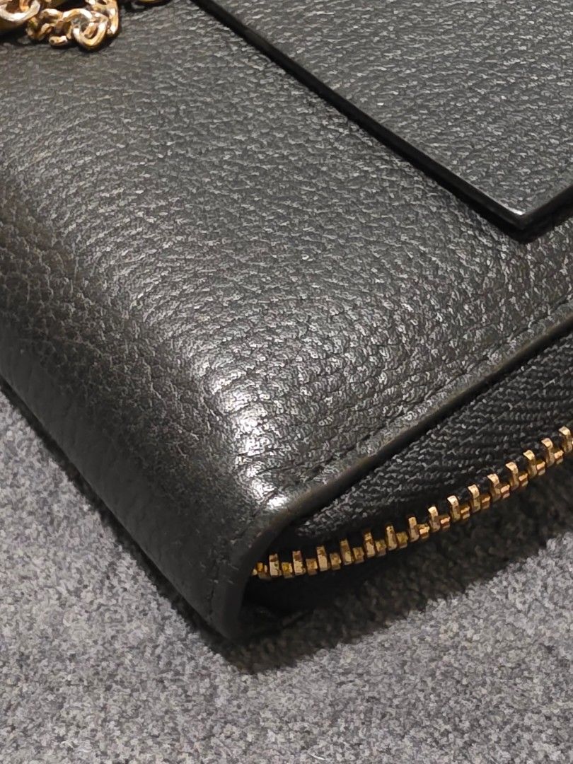 Chloe Black Leather Long Wallet with Gold Clasp (Category: Wallets & Card holders) located in Makati City. Submitted by bagattic_etc (Listing ID 1453431661, Image 3). Description: Brand: Chloé Model: Likely Elsie Zip-Around Continental Wallet Material: Pebbled calfskin leather Color: Black Hardware: Gold-tone turn-lock with decorative chain Made in Spain Zip-around closure for added security Front flap pocket with the iconic Elsie lock Multiple c