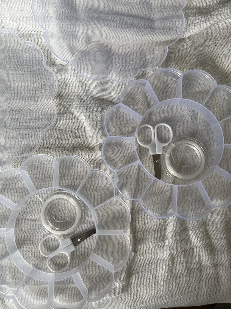 Clear Flower Shape Compartment Organizer with Scissors and Beads Thread (CAN ADD BEADS UPON REQUEST) (Category: Craft Supplies & Tools) located in Manila. Submitted by prima_onda (Listing ID 1453475096, Image 2). Description: - Adorable flower-shaped clear plastic organizers. - Multiple compartments for easy organization. - Each organizer includes a small pair of white scissors and a roll of clear tape. - Ideal for storing small craft supplies, b