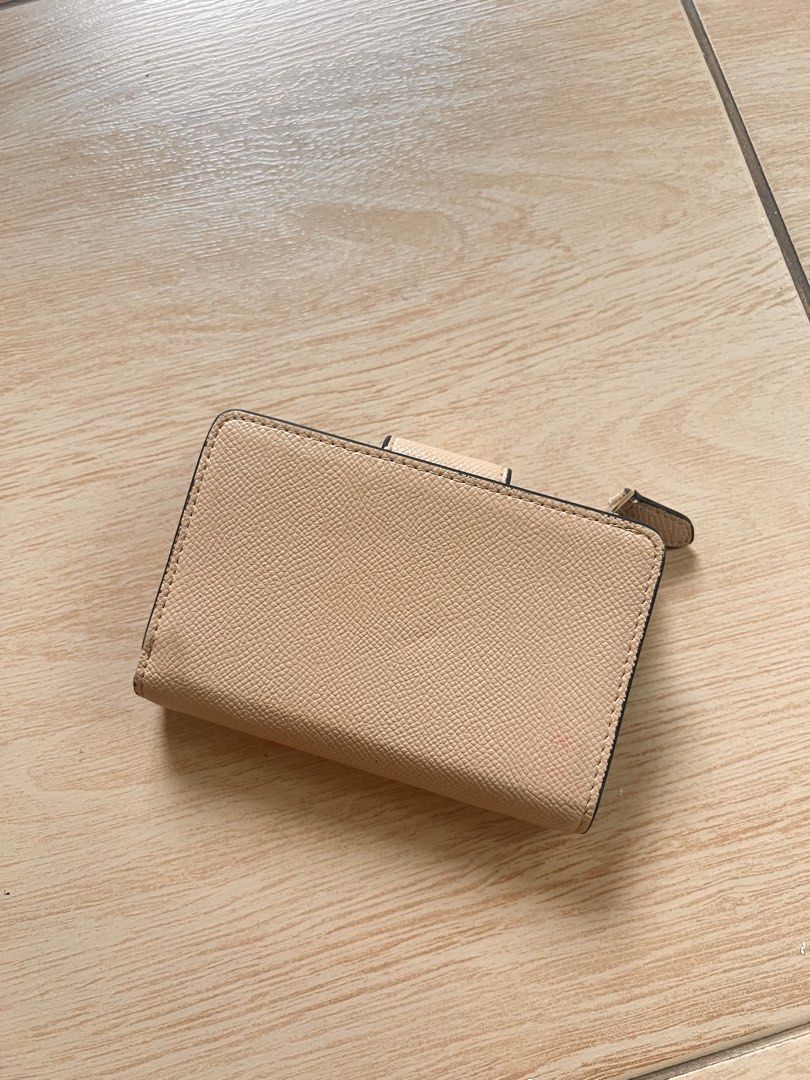 Coach Bifold Wallet - Beige (Category: Luxury Bags & Wallets) located in Burgos, Pangasinan. Submitted by acklaire (Listing ID 1453456084, Image 2). Description: - Coach trifold wallet - Nice beige color - Textured leather - Snap closure - Small and compact, fits easily in pocket or small bag - Great for everyday use - Clean inside and out.