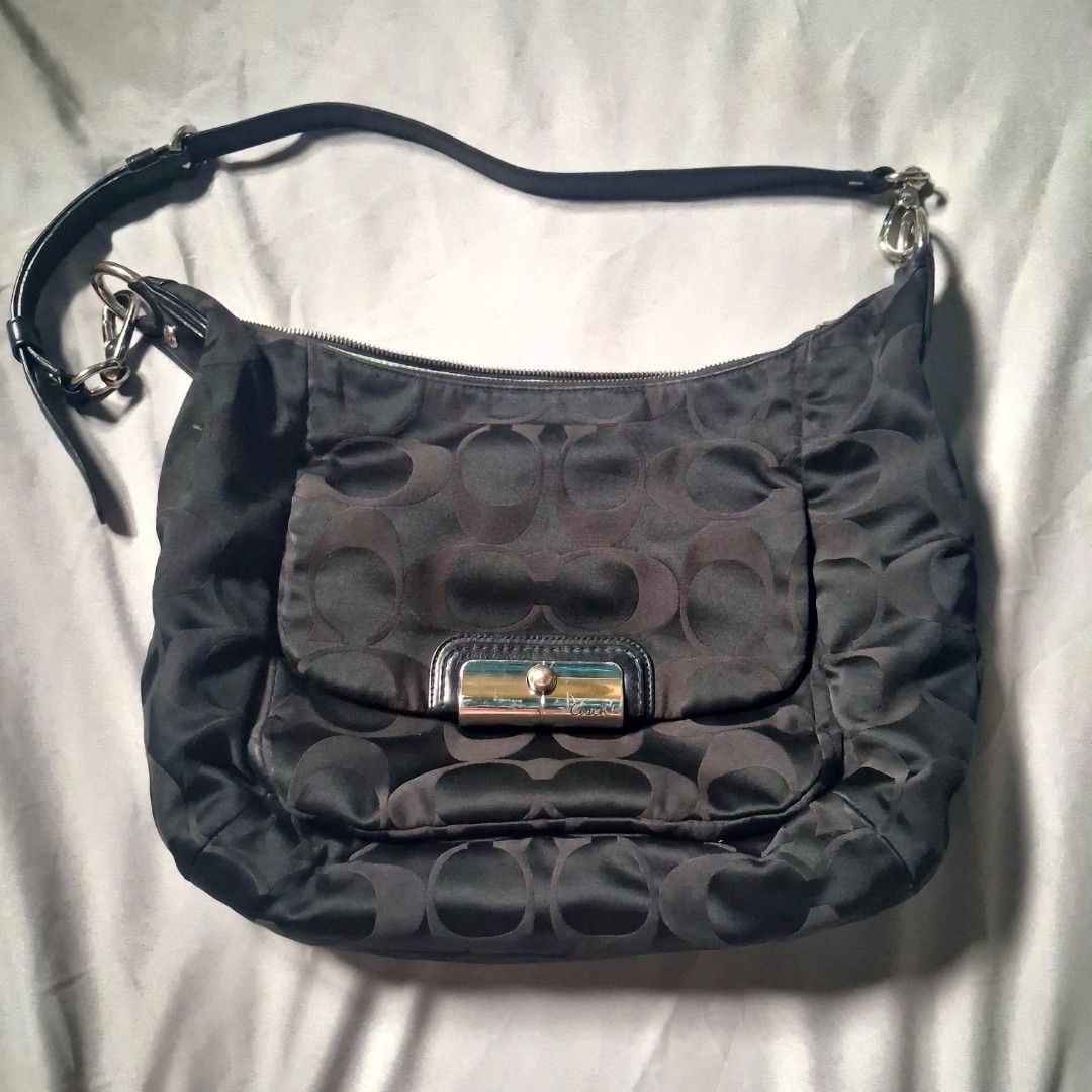 Coach Kristin Hobo Bag (Category: Luxury Bags & Wallets) located in Valenzuela. Submitted by sell.buy.acc (Listing ID 1453517864, Image 1). Description: - Authentic Black Coach Hobo Bag - Signature Coach Pattern - Genuine Leather Trim - Silver Hardware Accents - Bright Light Blue Interior - Secure Zipper Closure - Interior Serial Number Tag - Ideal for Everyday Carry.