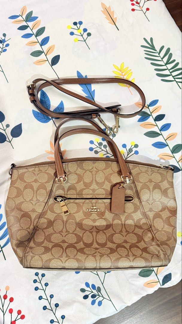 Coach Signature Monogram Canvas Satchel Bag (Category: Luxury Bags & Wallets) located in San Pablo. Submitted by dtanne (Listing ID 1453483712, Image 1). Description: - Coach monogram canvas satchel - Tan and brown signature print - Leather trim and handles - Zip top closure - Front zip pocket - Detachable crossbody strap included - Coach leather hangtag - Ideal for everyday use.