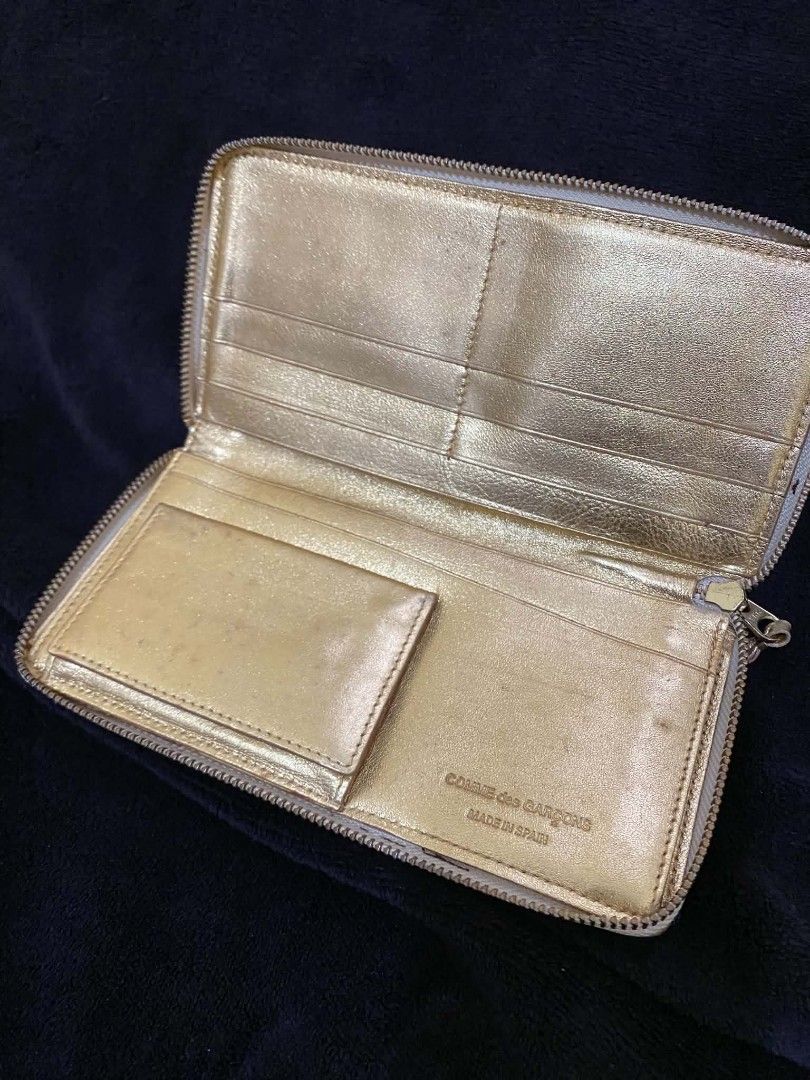 Comme des Garçons Gold Long Wallet (Category: Luxury Bags & Wallets) located in Calapan. Submitted by metriowendell22 (Listing ID 1453435789, Image 3). Description: CDG gold long wallet Authentic Dimes 8x4 Very good condition Sign of usage.