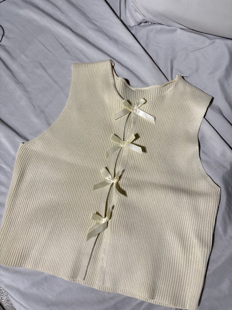 Cream Ribbed Knit Vest with Bows (Category: Sleeveless) located in Pasig City. Submitted by ___an.j (Listing ID 1453548650, Image 2). Description: Worn once only.