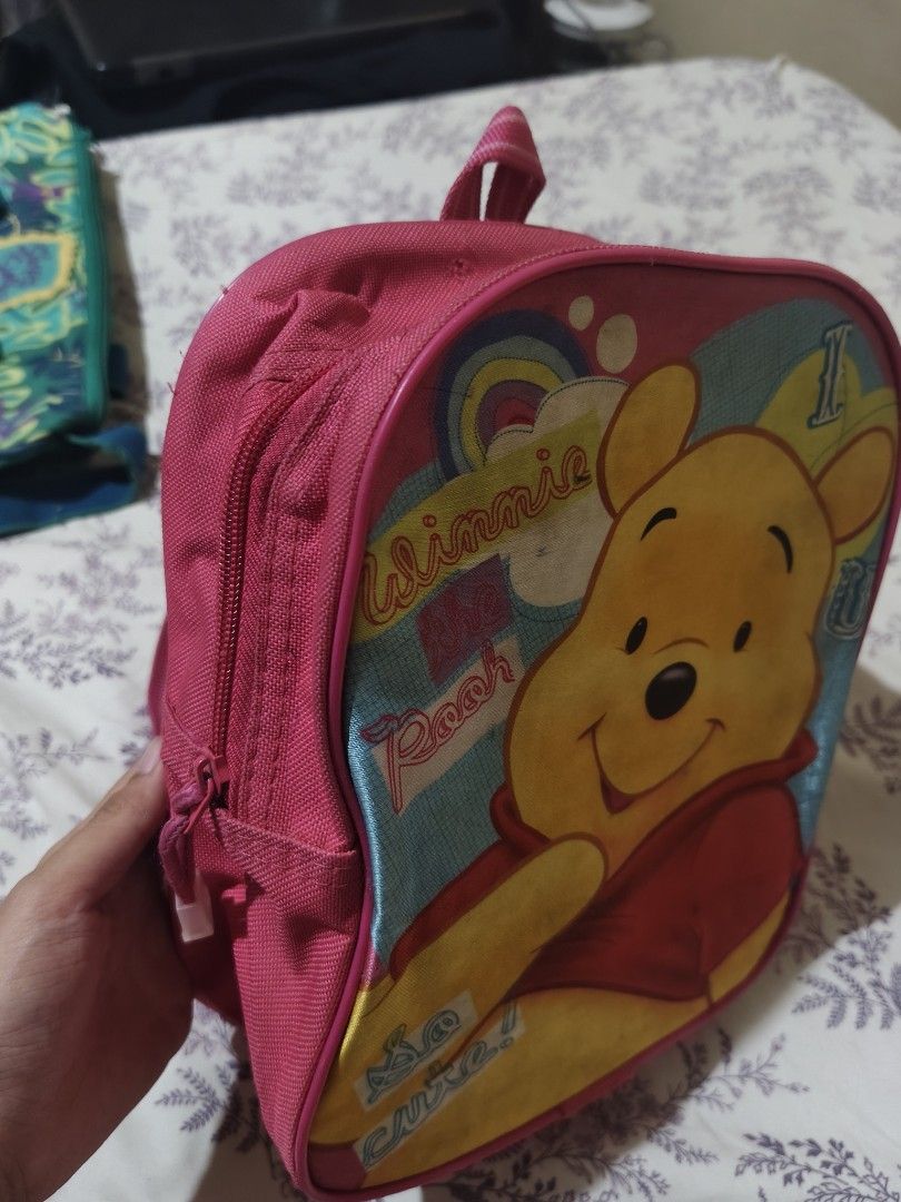Disney Winnie the Pooh pink small backpack (Category: Other Babies Going Out Needs) located in Bulacan. Submitted by angel.decluttersx (Listing ID 1453518940, Image 3). Description: zipper is working a small, 11-inch backpack suited for preschool or kindergarten. bought at SM dept store.
