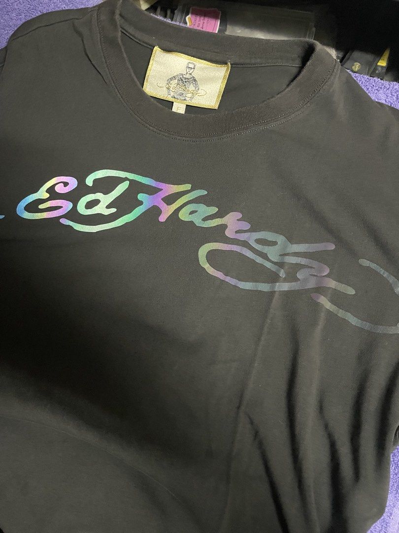 Ed Hardy T-shirt (Category: Tshirts & Polo Shirts ) located in Manila. Submitted by 2002kid (Listing ID 1453471378, Image 2). Description: - Authentic Grey Ed Hardy T-shirt - Features the iconic Ed Hardy logo graphic on the front - Reflective Logo - Made from 100% comfortable cotton - Ideal for everyday casual wear Size F it means fit to all size Color Smoke Grey Issue None Dimes Width: 23 Length: 28.