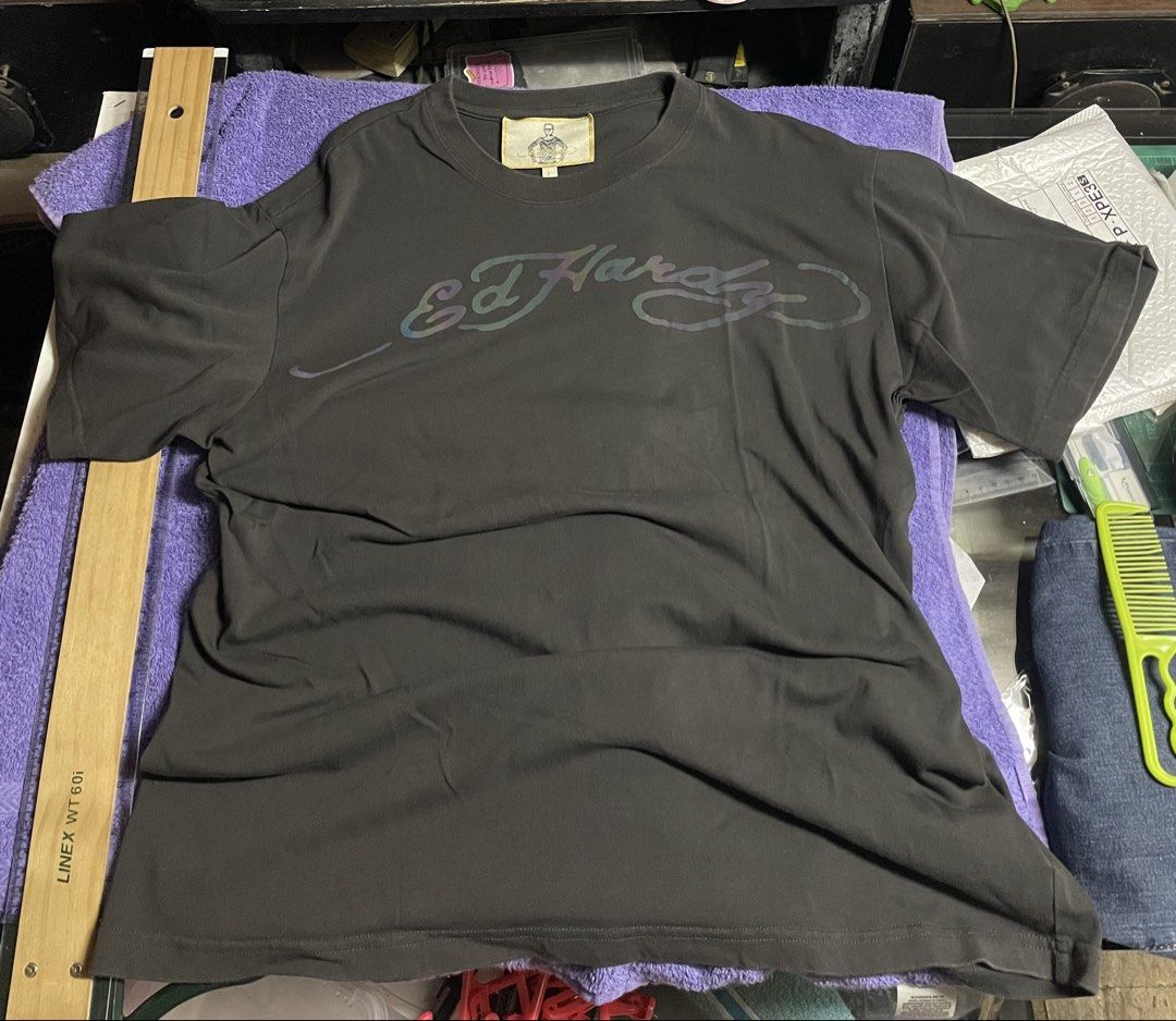 Ed Hardy T-shirt (Category: Tshirts & Polo Shirts ) located in Manila. Submitted by 2002kid (Listing ID 1453471378, Image 1). Description: - Authentic Grey Ed Hardy T-shirt - Features the iconic Ed Hardy logo graphic on the front - Reflective Logo - Made from 100% comfortable cotton - Ideal for everyday casual wear Size F it means fit to all size Color Smoke Grey Issue None Dimes Width: 23 Length: 28.