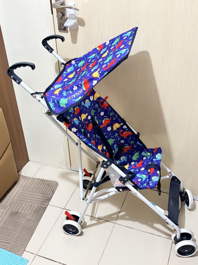 ENFANT Baby Stroller with Dinosaur Print (Category: Strollers) located in Pasig City. Submitted by dotestrada (Listing ID 1453459093, Image 1). Description: - Lightweight and easy to fold/carry - Fun dinosaur print canopy - Built-in sunshade for sun protection - Smooth-rolling wheels for easy maneuvering - Ideal for toddlers and quick outings.