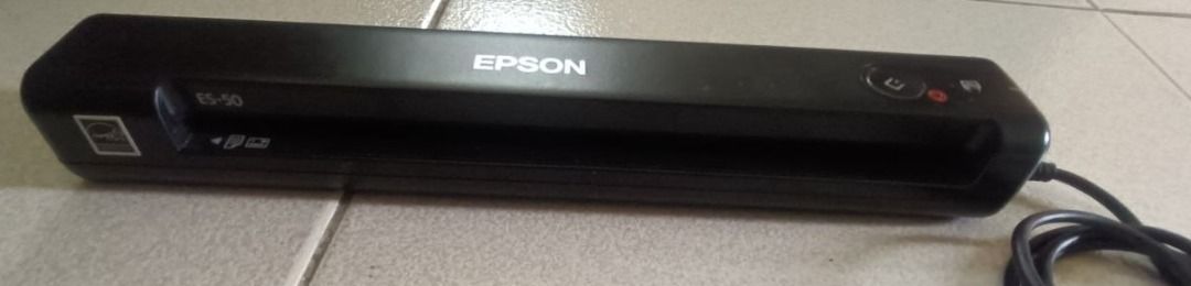 Epson WorkForce ES-50 Portable Document Scanner (Category: Printers, Scanners & Copiers) located in Davao. Submitted by scaras (Listing ID 1453592538, Image 3). Description: Epson WorkForce ES-50 Portable Document Scanner Note: > Purchased in the USA > Slightly used – Good as new > Doesn’t come with its original box * Meet-up: Dumoy (Davao City) Area Key Characteristics & Functions: • Form Factor: Features an ultra-compact, long, rectangular blac