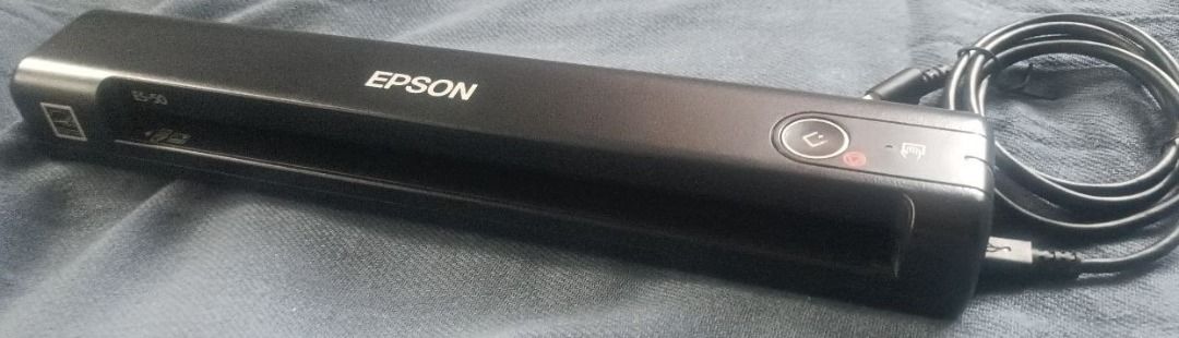 Epson WorkForce ES-50 Portable Document Scanner (Category: Printers, Scanners & Copiers) located in Davao. Submitted by scaras (Listing ID 1453592538, Image 2). Description: Epson WorkForce ES-50 Portable Document Scanner Note: > Purchased in the USA > Slightly used – Good as new > Doesn’t come with its original box * Meet-up: Dumoy (Davao City) Area Key Characteristics & Functions: • Form Factor: Features an ultra-compact, long, rectangular blac