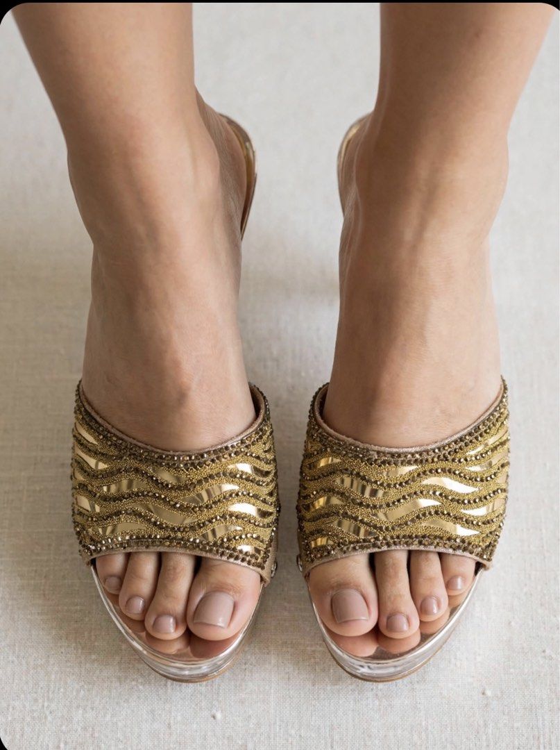 Figlia gold beaded mule heels size 6 (Category: Heels) located in Paranaque City. Submitted by ChloeCharles (Listing ID 1453503615, Image 1). Description: Gold mirror metallic footbed clear vinyl sides, open toe, and the wide vamp band is covered in gold bugle beads / woven lurex with tiny rhinestone edging. Mid to high block/wedge-style mule, slip-on.