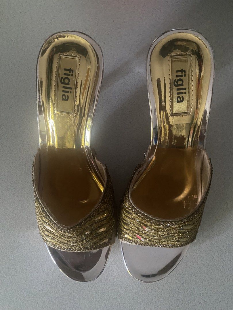 Figlia gold beaded mule heels size 6 (Category: Heels) located in Paranaque City. Submitted by ChloeCharles (Listing ID 1453503615, Image 3). Description: Gold mirror metallic footbed clear vinyl sides, open toe, and the wide vamp band is covered in gold bugle beads / woven lurex with tiny rhinestone edging. Mid to high block/wedge-style mule, slip-on.