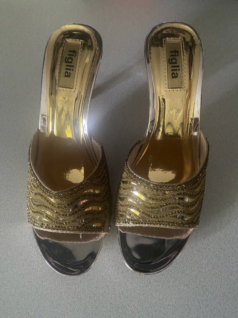 Figlia gold beaded mule heels size 6 (Category: Heels) located in Paranaque City. Submitted by ChloeCharles (Listing ID 1453503615, Image 2). Description: Gold mirror metallic footbed clear vinyl sides, open toe, and the wide vamp band is covered in gold bugle beads / woven lurex with tiny rhinestone edging. Mid to high block/wedge-style mule, slip-on.