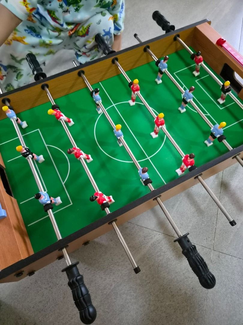Flying Tiger Tabletop Foosball (Category: Board Games & Puzzles) located in Tanza. Submitted by mama_1996sagi (Listing ID 1453620328, Image 1). Description: - Flying Tiger Tabletop Foosball game - Compact and portable design - Features a vibrant green playing field - Includes colorful player figures - Sturdy rods for smooth gameplay - Perfect for indoor fun and quick matches.