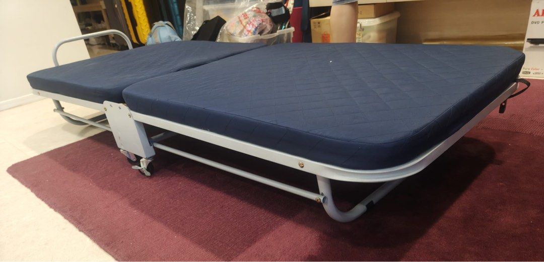 Foldable bed (Category: Bed Frames & Mattresses) located in Singapore. Submitted by tytyp (Listing ID 1453557441, Image 2). Description: Preloved foldable bed with wheels but 1 wheel may have been slightly damaged. Size 75x185cm Mattress is not thick so need to top up mattress for more comfortable sleep. Collect from AMK ave 2 at my convenience only..