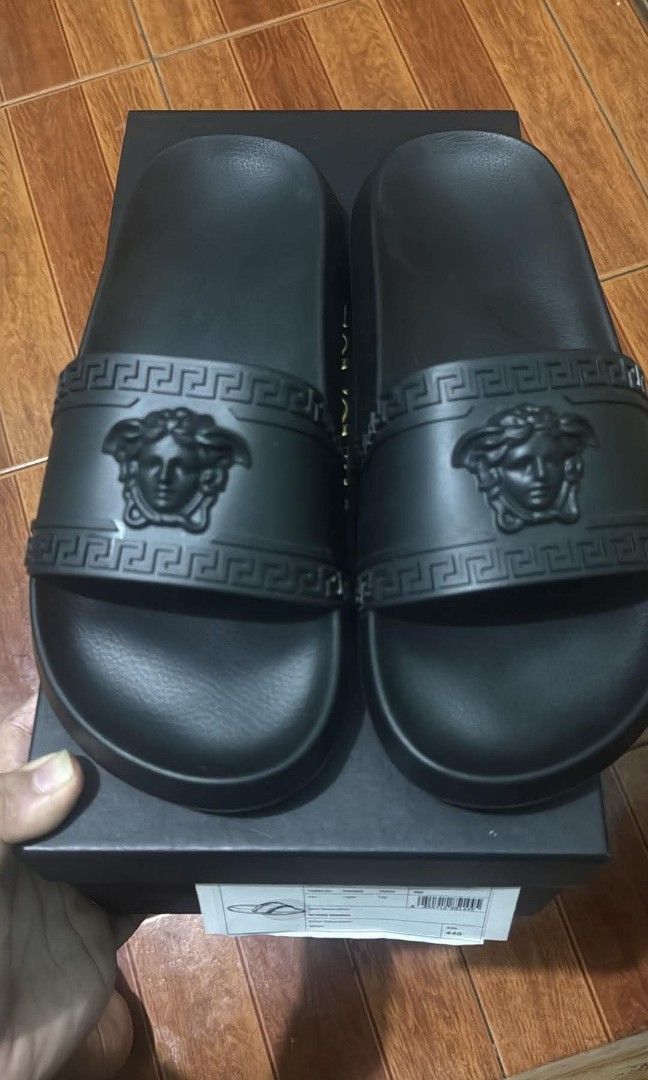 FOR SALE (Category: Slippers & Slides) located in Manila. Submitted by pusha____pss (Listing ID 1453615135, Image 2). Description: FOR SALE VERSACE PALAZZO RUBBER SLIDE SIZE 44 COMPLETE CARD AND DUST BAG USED ONCE ALMOST NEW PADIN!.