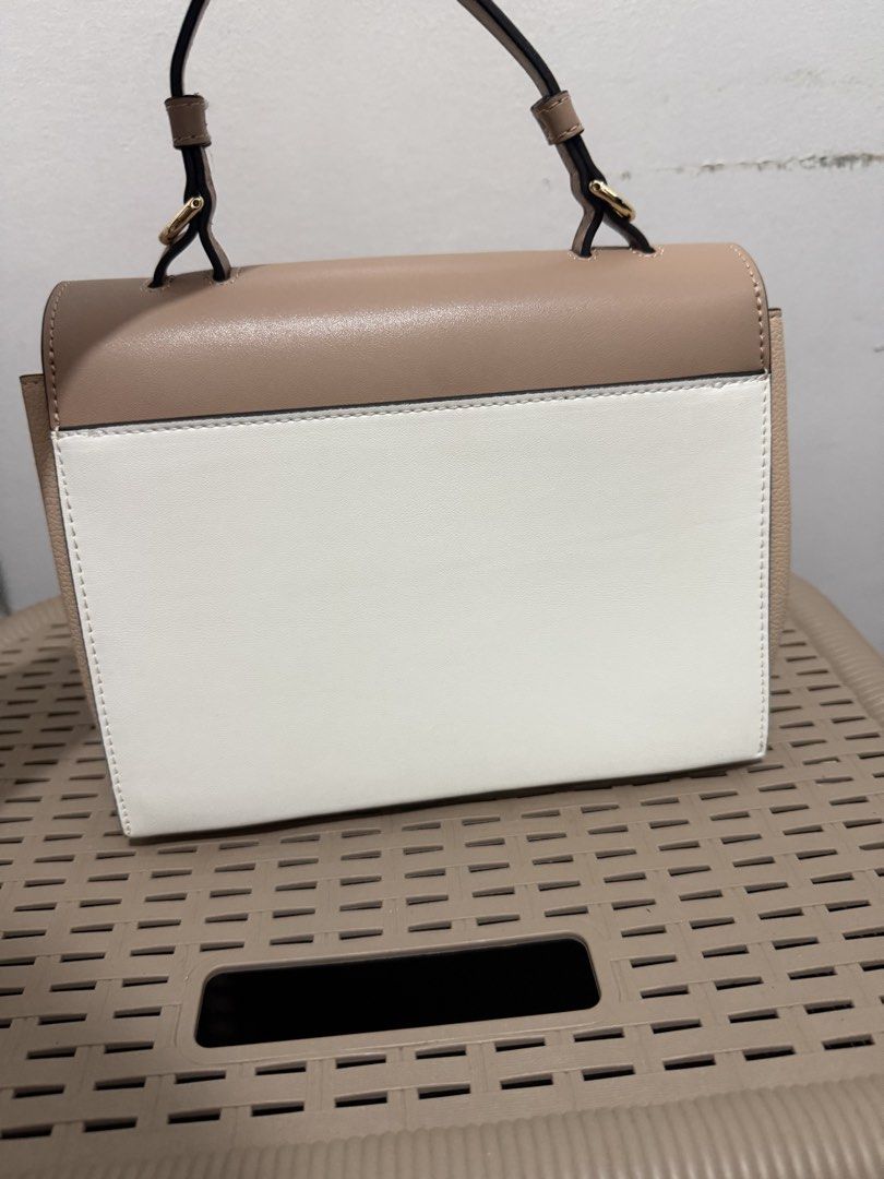 Furla Emma Mini 2-way Bag (Category: Luxury Bags & Wallets) located in Muntinlupa City. Submitted by bashabells (Listing ID 1453578155, Image 3). Description: - Furla Emma Mini 2-way bag - Beige and white color block design - Gold hardware with signature Furla logo clasp - Versatile with top handle and detachable long strap - Clean interior.