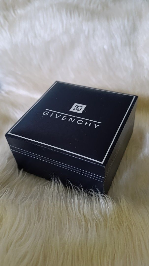 Givenchy Jewelry Box (Category: Accessory Holder, Box & Organizers) located in Gingoog City. Submitted by ThePurpleBox (Listing ID 1453439865, Image 2). Description: - Authentic Givenchy box - Color: Dark blue exterior with white Givenchy logo and emblem - Interior: Lined with white material - Perfect for storing small jewelry, trinkets, or as a gift.
