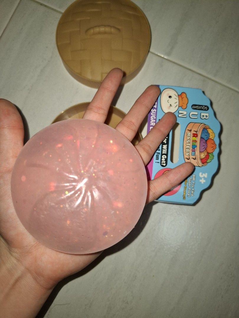 Gliter dumpling (Category: Kids Toys) located in Singapore. Submitted by greengrass.369 (Listing ID 1453570433, Image 3). Description: - Squishy Bun mystery fidget toy - Jelly-like texture - Features a light glittery pink color - Fun and satisfying to squish - Perfect for fidgeting.