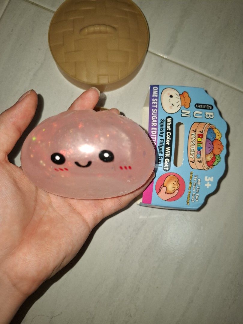 Gliter dumpling (Category: Kids Toys) located in Singapore. Submitted by greengrass.369 (Listing ID 1453570433, Image 2). Description: - Squishy Bun mystery fidget toy - Jelly-like texture - Features a light glittery pink color - Fun and satisfying to squish - Perfect for fidgeting.