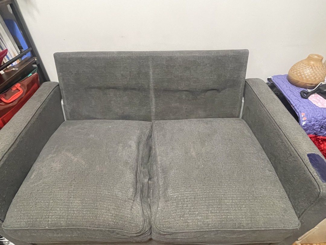 Grey 2-Seater Sofa (Category: Sofas) located in Makati City. Submitted by loushhh (Listing ID 1453519803, Image 2). Description: - Grey 2-seater sofa - Fabric upholstery - Removable cushions - Ideal for small spaces - Minor marks on fabric (please check photos) - Sturdy and functional.