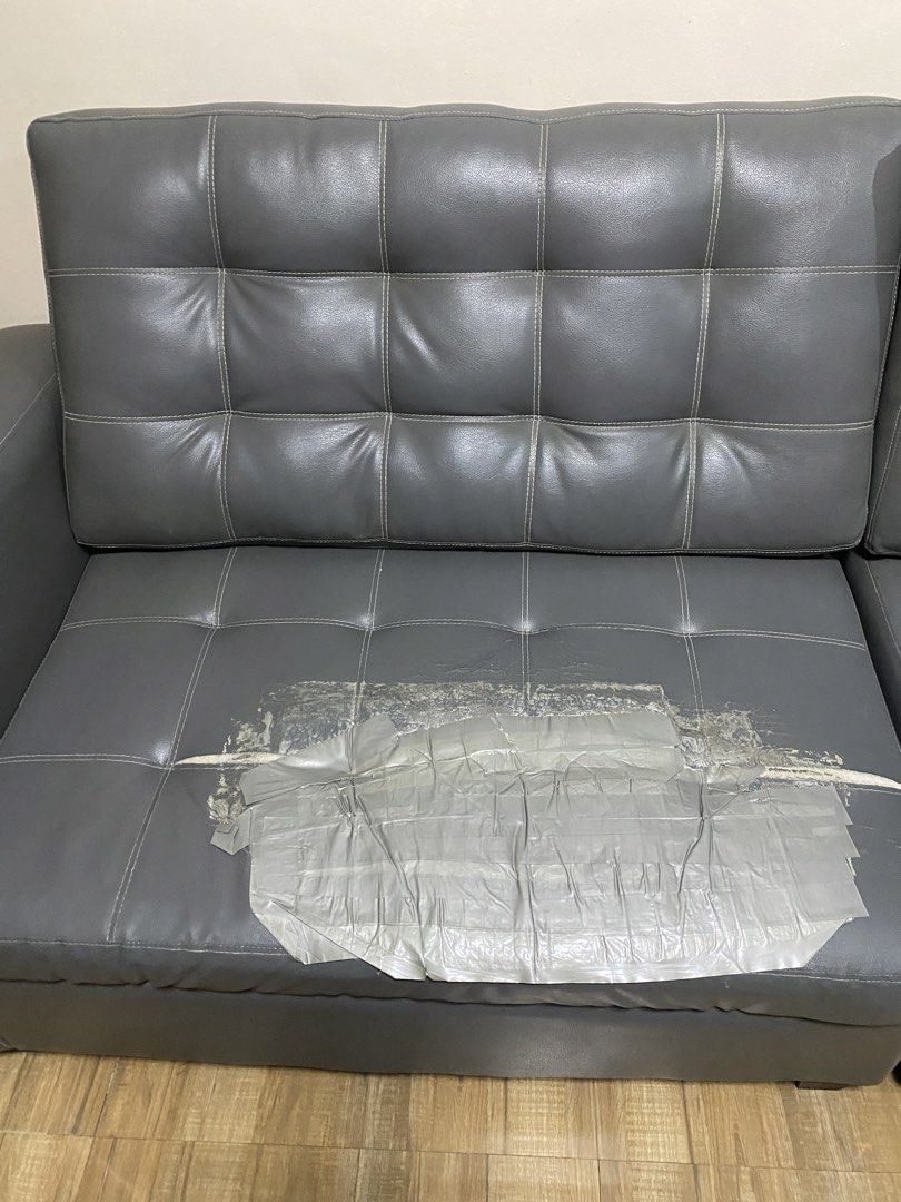 Grey Faux Leather Tufted Sofa with Chaise (Category: Sofas) located in Antipolo. Submitted by doki_bake (Listing ID 1453557817, Image 3). Description: - Grey faux leather sofa - Features a chaise section - Tufted cushion design - Still comfortable and functional for lounging - Ideal for living rooms or dens - Sold as is - Pick up only.