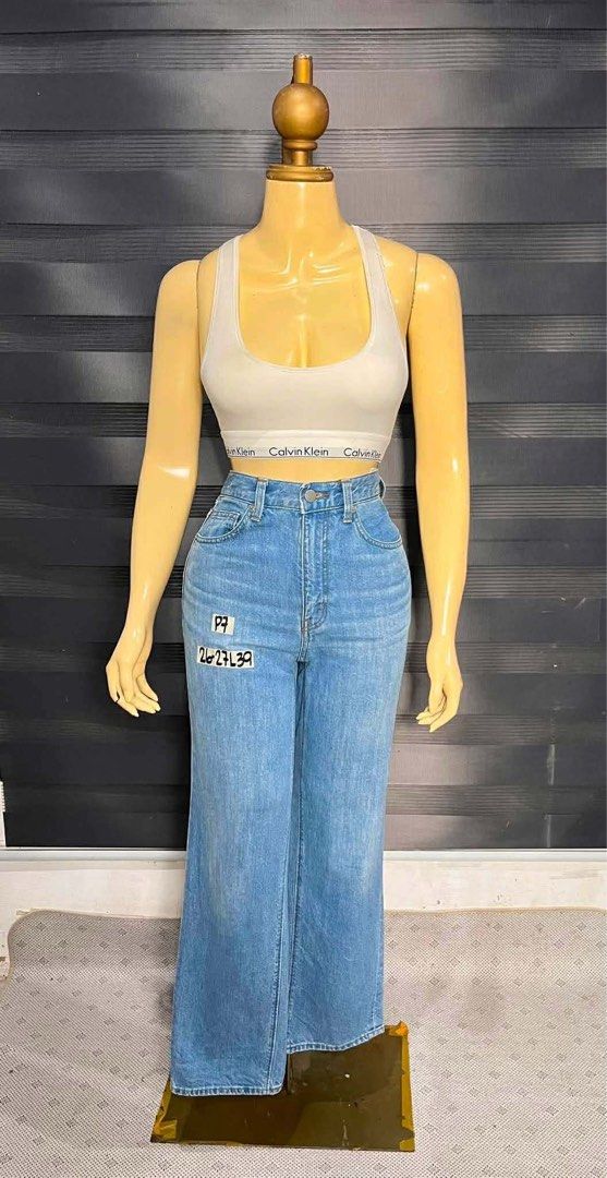 Gu by Uniqlo Pants (Category: Jeans) located in Cabanatuan. Submitted by doelly1221 (Listing ID 1453549420, Image 1). Description: - White Calvin Klein crop top with matching band - Blue denim wide leg jeans - High-waisted fit - Perfect for casual, everyday wear - Comfortable and stylish outfit.