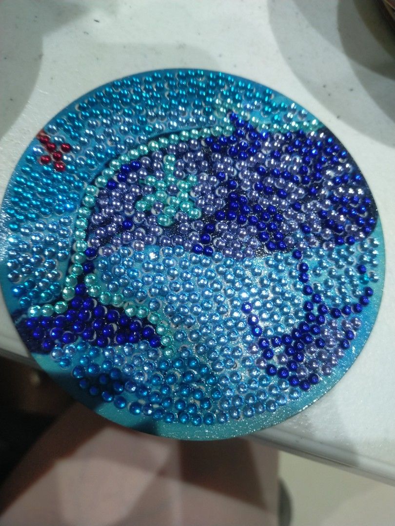 Handmade Diamond Painting Coaster - Blue Ocean Theme (Category: Handmade Craft) located in Pagadian. Submitted by kimygo (Listing ID 1453564712, Image 1). Description: - Beautiful blue ocean design coaster - Made with sparkling diamond beads - Protects surfaces from damage - Doubles as a unique decorative piece - Handmade item - Adds a vibrant pop of color to any space.