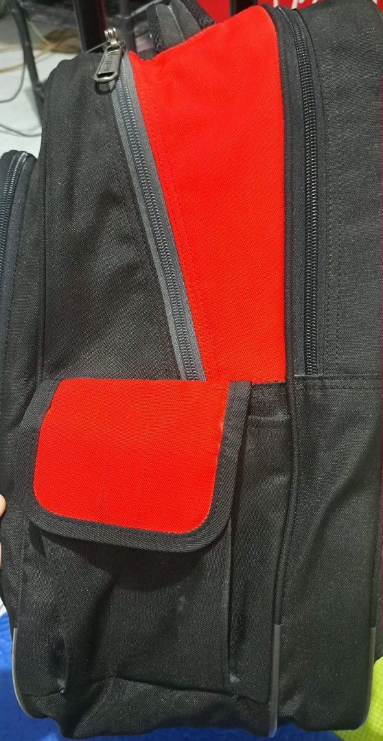 Hawk Large Backpack Stroller (Category: Backpacks) located in Cainta. Submitted by origeetostore (Listing ID 1453442974, Image 3). Description: - Durable black and red rolling backpack - Multiple zippered compartments and pockets - Side mesh pockets for water bottles or essentials - Padded shoulder straps for comfortable carrying - Smooth-rolling wheels and retractable handle for effortless transport - Ideal for school, college, or travel adventu