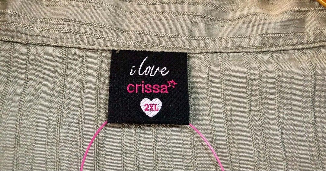I Love Crissa 2XL Top (Category: Blouses) located in Imus. Submitted by sharislane (Listing ID 1453465584, Image 3). Description: - Olive green ribbed top - Brand: I Love Crissa - Size: 2XL - Features a cute heart detail on the tag - Ideal for casual outfits.