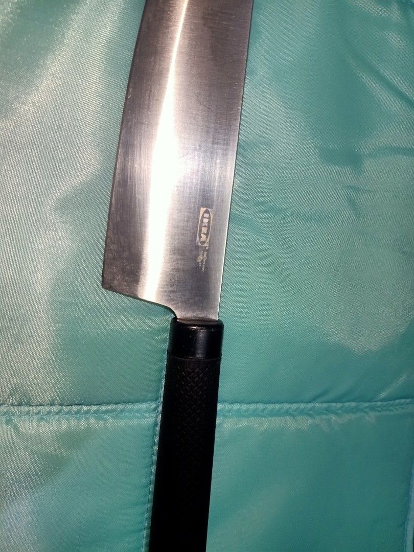 IKEA Chef Knife - Santoku Style (Category: Knives & Chopping Boards) located in Pasig City. Submitted by urdal01 (Listing ID 1453592070, Image 1). Description: - IKEA Santoku style chef knife - Approximately 7-inch stainless steel blade - Black, textured handle for a secure grip - Ideal for chopping and slicing tasks - Shows some signs of use, but remains sharp and fully functional.