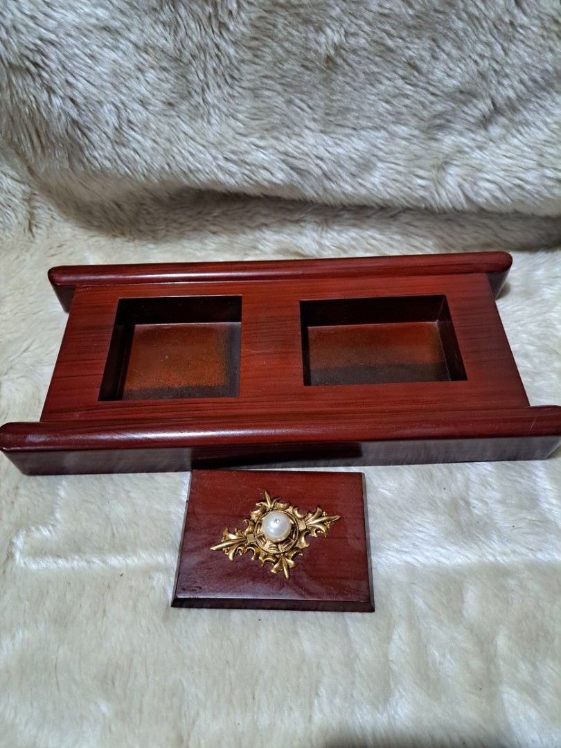 Cigarette Holder with Decorative Top (Category: Home Fragrance) located in Quezon City. Submitted by sbvdmanaog (Listing ID 1453592279, Image 1). Description: - Elegant incense burner - Two compartments for ash catching or incense sticks - Decorative gold accent with a pearl on top - Smooth, nice wood finish - Approximately 8 inches tall - Ideal for your desk or altar.