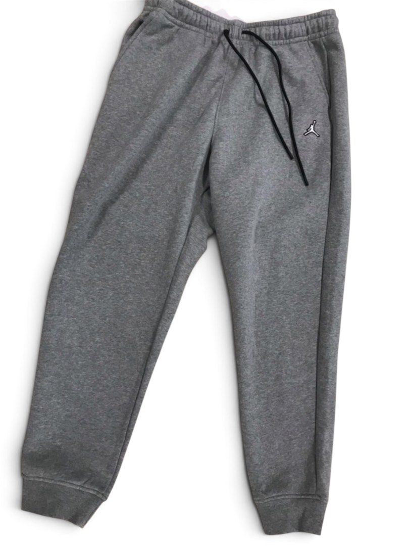 Jordan Grey Sweatpants Joggers (Category: Joggers) located in Manila. Submitted by patriciamikaela_ (Listing ID 1453493668, Image 1). Description: - Grey Jordan sweatpants - Elastic waistband with drawstring - Two side pockets - Embroidered Jumpman logo on left thigh - Ribbed cuffs - Ideal for lounging or workouts.