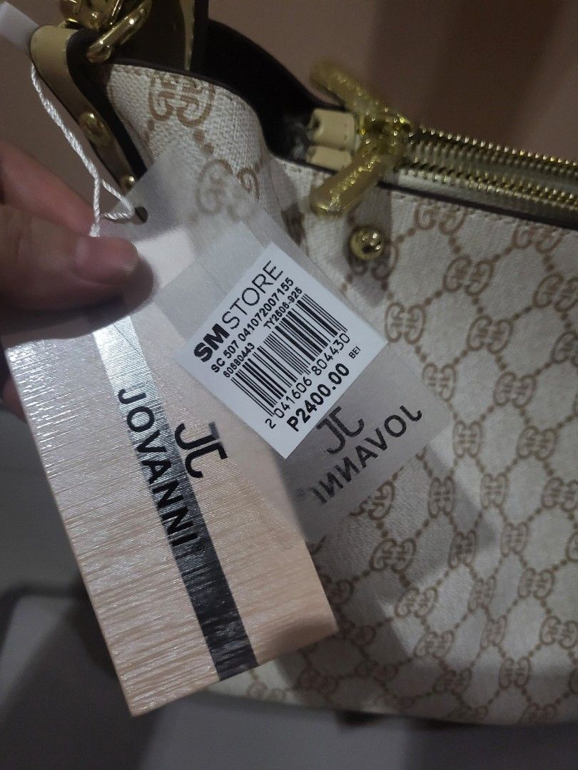 JOVANNI Monogram Shoulder Bag (Category: Luxury Bags & Wallets) located in Marikina City. Submitted by starbright101 (Listing ID 1453616402, Image 2). Description: - Authentic JOVANNI shoulder bag - All-over monogram print - Classic beige and brown colorway - Elegant gold hardware details on zippers - Includes a detachable strap for versatile styling - Brand new with original tags still attached - Purchased from SM Store.