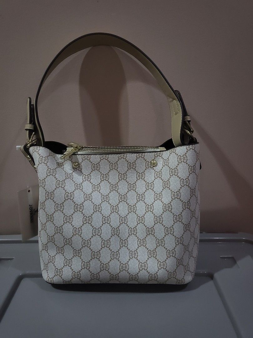 JOVANNI Monogram Shoulder Bag (Category: Luxury Bags & Wallets) located in Marikina City. Submitted by starbright101 (Listing ID 1453616402, Image 1). Description: - Authentic JOVANNI shoulder bag - All-over monogram print - Classic beige and brown colorway - Elegant gold hardware details on zippers - Includes a detachable strap for versatile styling - Brand new with original tags still attached - Purchased from SM Store.