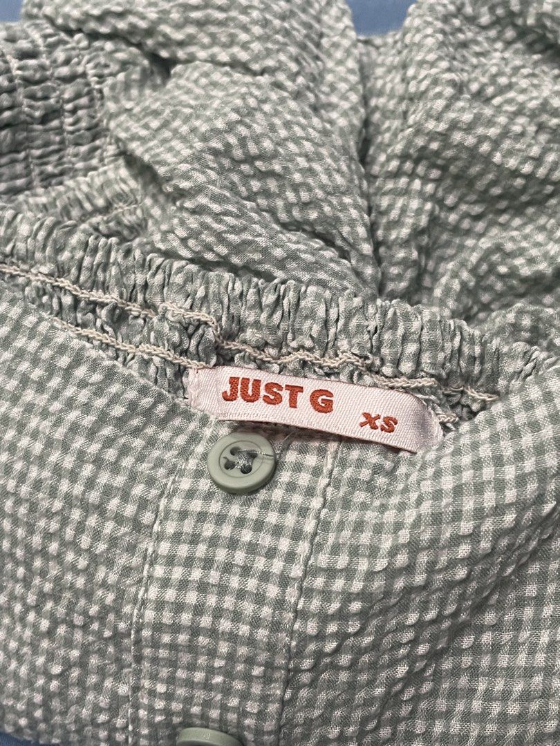 JUST G Gingham Puff Sleeve Square Neck Top XS (Category: Blouses) located in Marikina City. Submitted by flutterchi (Listing ID 1453584659, Image 2). Description: - Cute gingham top from JUST G. - Features puff sleeves with elasticated cuffs. - Square neckline with button details down the front. - Ruffled hemline for a feminine touch. - Estimated size XS. - Ideal for casual everyday wear..