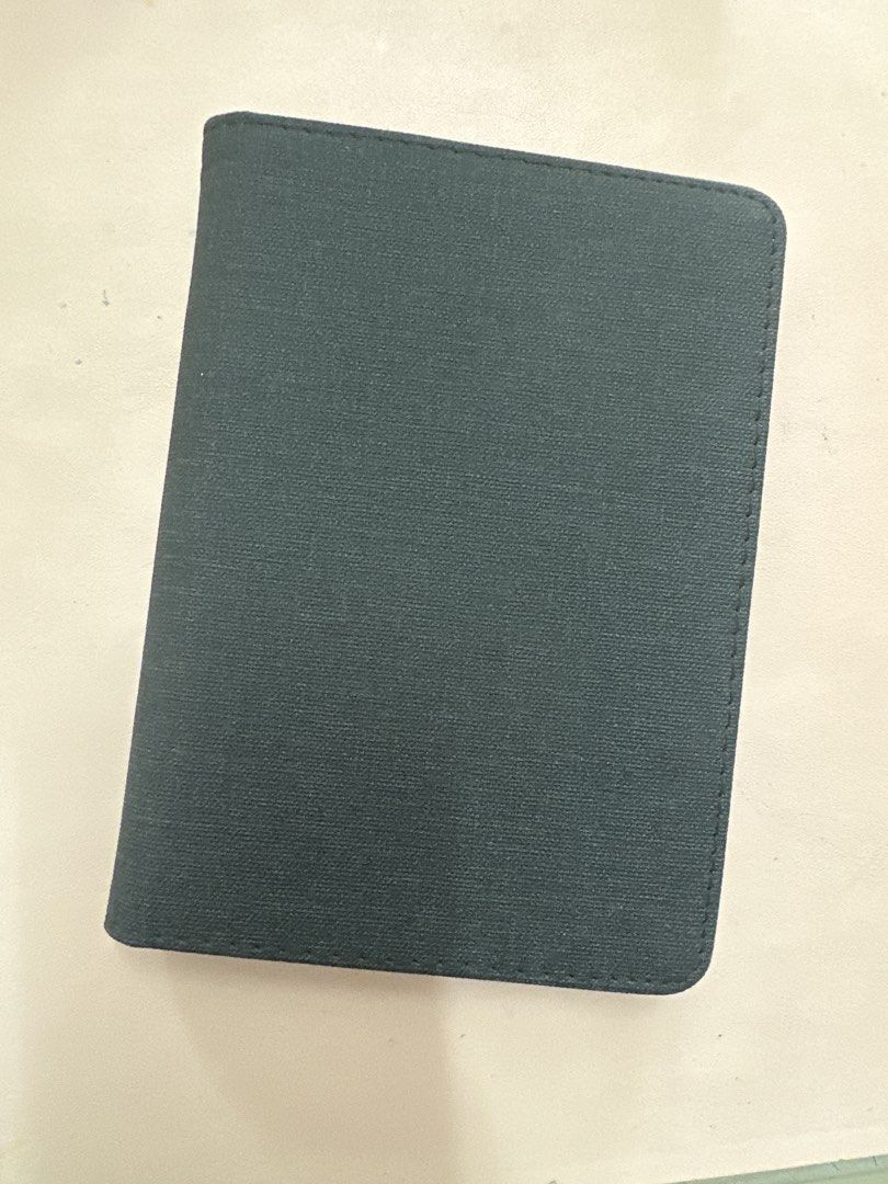 Kindle Basic 11th gen Dark Grey Folio Case for Tablet with Stand (Category: Cases & Sleeves) located in Davao. Submitted by mblee322 (Listing ID 1453434501, Image 1). Description: - Dark grey folio case for tablets - Built-in stand for hands-free viewing - Interior card slots - Secure device holder - Magnetic clasp closure - Protects against scratches and bumps - Perfect for travel or everyday use.