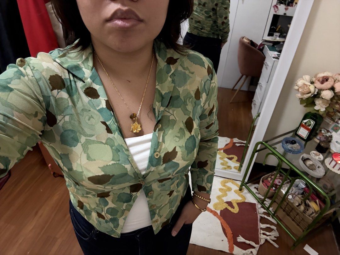 KOOKAI Floral Print Button-Up Shirt (Category: Longsleeves) located in Caloocan City. Submitted by kaycakes (Listing ID 1453524829, Image 3). Description: - Cute green and blue floral print cardigan - Long sleeves - Collared neckline - Button-up front - Versatile for casual or dressy looks - Size 2.