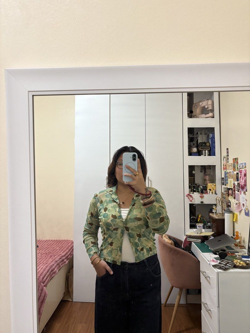 KOOKAI Floral Print Button-Up Shirt (Category: Longsleeves) located in Caloocan City. Submitted by kaycakes (Listing ID 1453524829, Image 2). Description: - Cute green and blue floral print cardigan - Long sleeves - Collared neckline - Button-up front - Versatile for casual or dressy looks - Size 2.