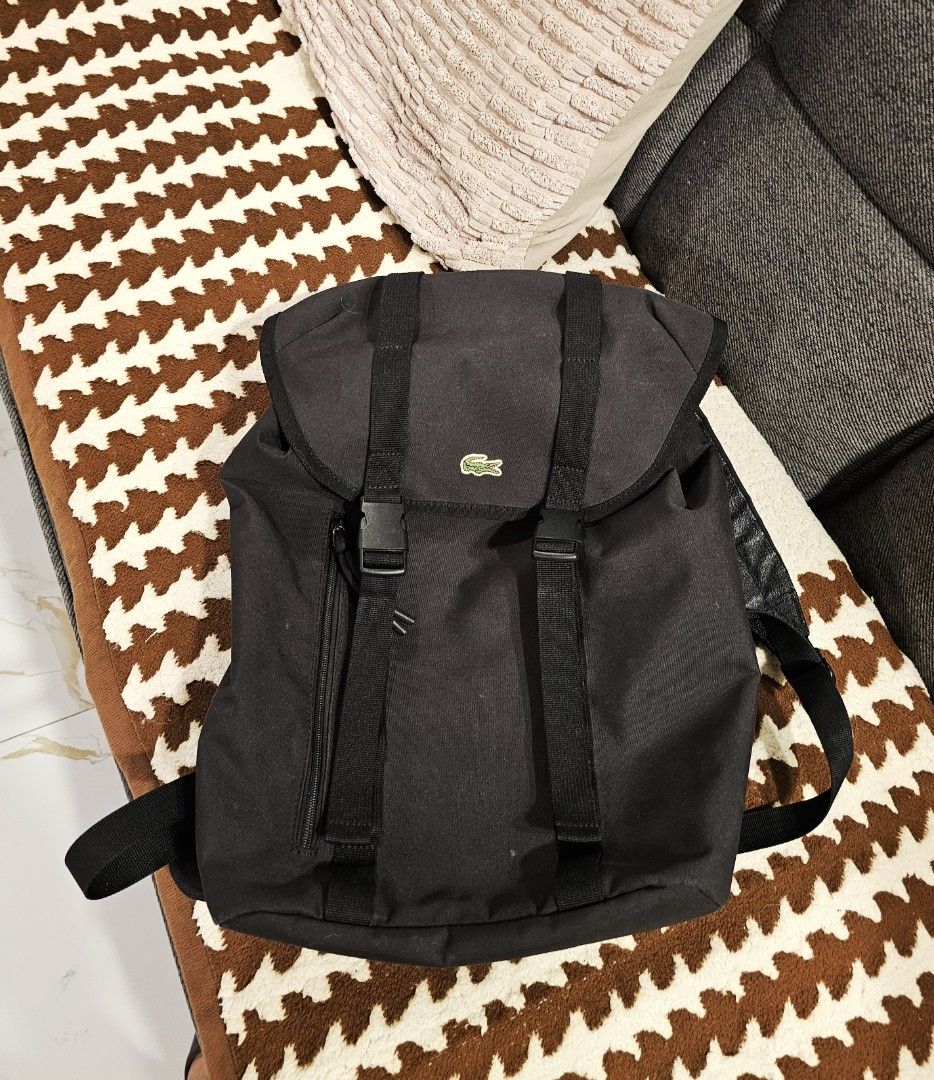Lacoste Backpack (Category: Backpacks) located in Makati City. Submitted by richpaul_ (Listing ID 1453546689, Image 3). Description: - Stylish black roll-top backpack - Comfortable padded mesh back panel - Adjustable shoulder straps for a perfect fit - Durable material built to last - Ample interior space for all your essentials - Ideal for daily use, work, or travel adventures.